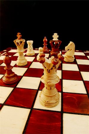 simsearch:640-01351370,k - chess pieces on chess board showing competition success and strategy in business Stock Photo - Budget Royalty-Free & Subscription, Code: 400-04764818