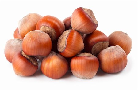 Heap of hazelnuts isolated over white background Fotografie stock - Microstock e Abbonamento, Codice: 400-04764950