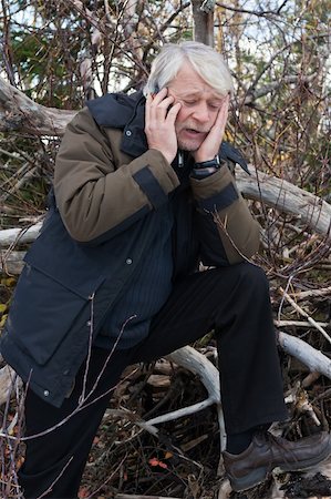 simsearch:400-04504842,k - Mature busy man with grey hair in forest talking on the phone in autumn day. Photographie de stock - Aubaine LD & Abonnement, Code: 400-04765145