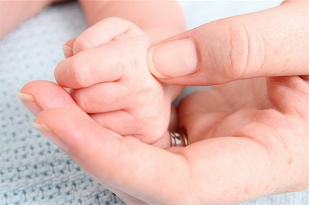 simsearch:400-04235194,k - Hand of a baby in his mothers hand Stock Photo - Budget Royalty-Free & Subscription, Code: 400-04765339