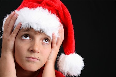 simsearch:400-05284316,k - Young boy wearing a red shirt and christmas hat Stockbilder - Microstock & Abonnement, Bildnummer: 400-04765415
