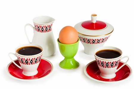 simsearch:400-05383364,k - Egg, two coffee cups, milk jug and sugar bowl isolated on a white background Photographie de stock - Aubaine LD & Abonnement, Code: 400-04765660