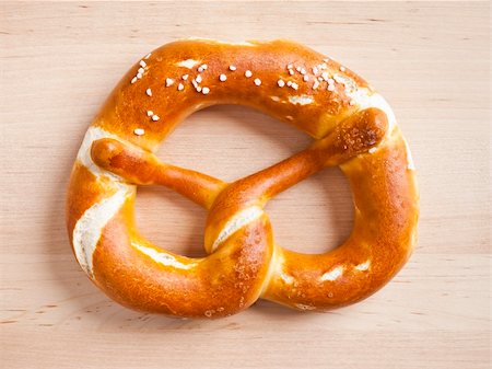 typical german pretzel on a wooden plate Stock Photo - Budget Royalty-Free & Subscription, Code: 400-04766234