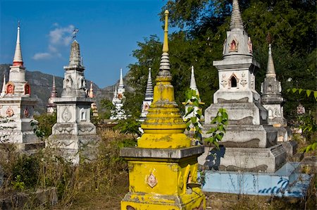 beautiful old colorful chedis on a a thai cemetery Stock Photo - Budget Royalty-Free & Subscription, Code: 400-04766278