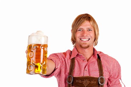 dimple mug - Happy smiling man with leather trousers (lederhose) holds oktoberfest beer stein. Isolated on white background. Stock Photo - Budget Royalty-Free & Subscription, Code: 400-04766284