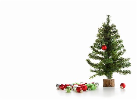 round ornament hanging of a tree - Small artifical tree with ornaments on white background Stock Photo - Budget Royalty-Free & Subscription, Code: 400-04766461