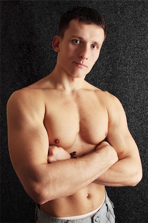 skin biceps - Beautiful sinewy young man/the naked torso Stock Photo - Budget Royalty-Free & Subscription, Code: 400-04767001