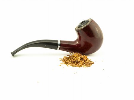 rauchpause - brown tube for smoking and heap of the tobacco near it Stockbilder - Microstock & Abonnement, Bildnummer: 400-04767232