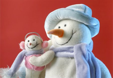Snowman with his little baby on the red background Stock Photo - Budget Royalty-Free & Subscription, Code: 400-04767568