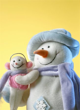 Snowman with his little baby on yellow background Stock Photo - Budget Royalty-Free & Subscription, Code: 400-04767570