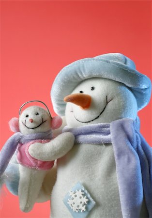 snowmen with his baby on the red background Stock Photo - Budget Royalty-Free & Subscription, Code: 400-04767571