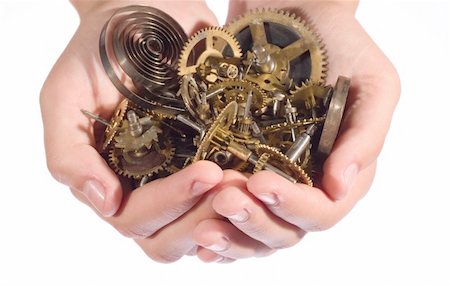 small parts of broken clock in palms Stock Photo - Budget Royalty-Free & Subscription, Code: 400-04767685