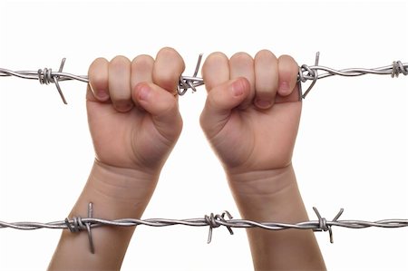 siege - child hand on barbed wire Stock Photo - Budget Royalty-Free & Subscription, Code: 400-04767830