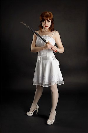 Young beautiful girl armed with a sword Stock Photo - Budget Royalty-Free & Subscription, Code: 400-04767972