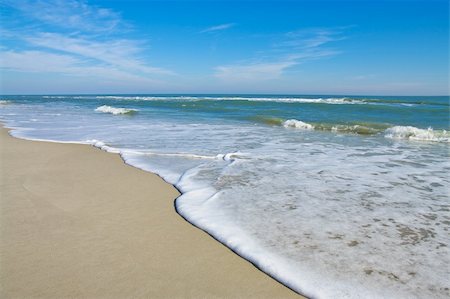Gentle waves reach the sand at Assateague Island National Seashore. Fotografie stock - Microstock e Abbonamento, Codice: 400-04768141