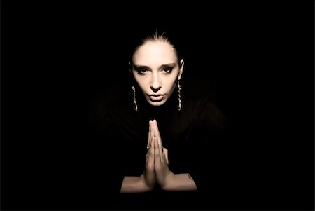 simsearch:400-04267059,k - Portrait of a young seductive brunette praying Photographie de stock - Aubaine LD & Abonnement, Code: 400-04768295