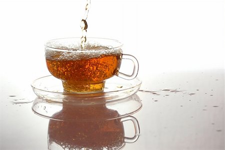 pouring water in tea pot - cup of tea with reflection and copyspace Stock Photo - Budget Royalty-Free & Subscription, Code: 400-04768437