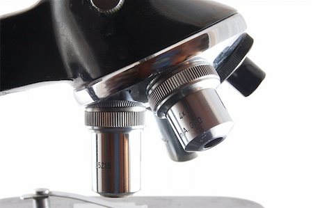 Old microscope isolated on a white background Photographie de stock - Aubaine LD & Abonnement, Code: 400-04768478
