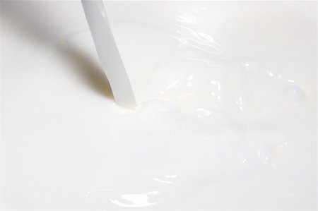 plunge - milk splashing into fresh milk with drops Stock Photo - Budget Royalty-Free & Subscription, Code: 400-04768479