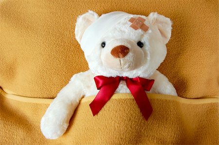 sick teddy bear in bed waiting for the doctor Stock Photo - Budget Royalty-Free & Subscription, Code: 400-04768481