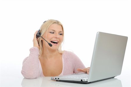 simsearch:400-05209692,k - Young woman with microphone and computer having online conversation throw internet. help desk assistant Stock Photo - Budget Royalty-Free & Subscription, Code: 400-04768768