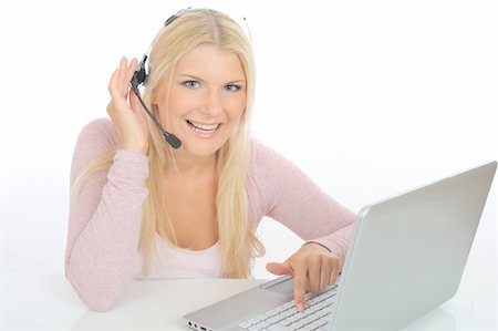 simsearch:400-05209692,k - Young woman with microphone and computer having online conversation throw internet. help desk assistant Stock Photo - Budget Royalty-Free & Subscription, Code: 400-04768770