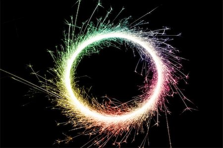 stockarch (artist) - bright multi colored circle of glowing sparks on a black background Stock Photo - Budget Royalty-Free & Subscription, Code: 400-04769204