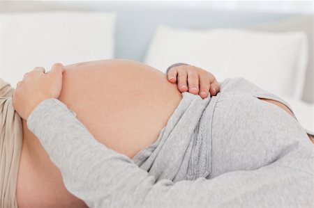 simsearch:400-04266869,k - Close up of a future mother relaxing on the bed at home Stock Photo - Budget Royalty-Free & Subscription, Code: 400-04769493