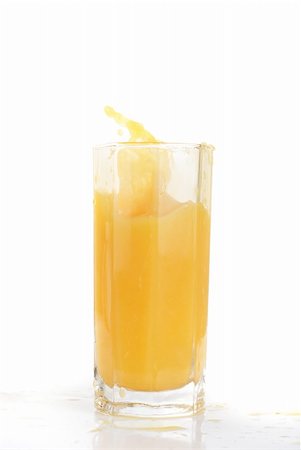 simsearch:400-04398564,k - orange juice splash isolated on a white background Stockbilder - Microstock & Abonnement, Bildnummer: 400-04769829