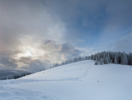 simsearch:400-05291390,k - Evening winter mountain landscape with sun in clouds (Kukol Mount, Carpathian Mountains, Ukraine) Stock Photo - Budget Royalty-Free & Subscription, Code: 400-04760079