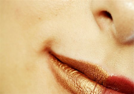 simsearch:400-05676902,k - Macro image of bright lips. Red and gold lipstik Stock Photo - Budget Royalty-Free & Subscription, Code: 400-04760349