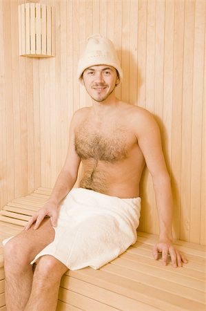 Young handsome man in a towel relaxing in a russian wooden sauna Stock Photo - Budget Royalty-Free & Subscription, Code: 400-04760469