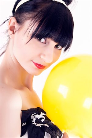 simsearch:400-04267059,k - Portrait of a young beautiful brunette posing with yellow ball Photographie de stock - Aubaine LD & Abonnement, Code: 400-04760488