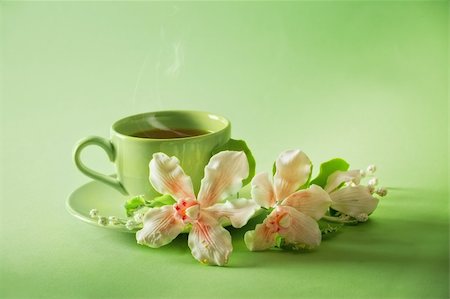 simsearch:400-04232483,k - The cup of green tea with caramel orchid on green background Stock Photo - Budget Royalty-Free & Subscription, Code: 400-04760498