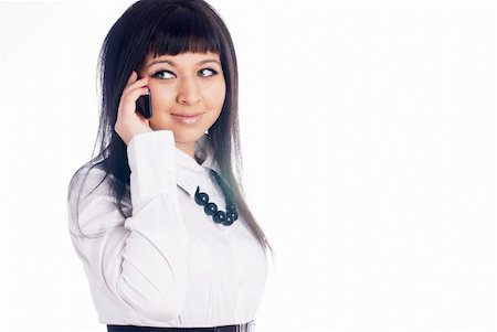 simsearch:400-05751258,k - Young smiling woman talking by mobile phone at isolated backgtound Stock Photo - Budget Royalty-Free & Subscription, Code: 400-04760500