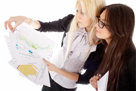 Two businesswoman looks on the graph on white background. Stock Photo - Budget Royalty-Free & Subscription, Code: 400-04761186
