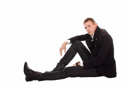 The serious man sitting on a floor against a white background. Stock Photo - Budget Royalty-Free & Subscription, Code: 400-04761196