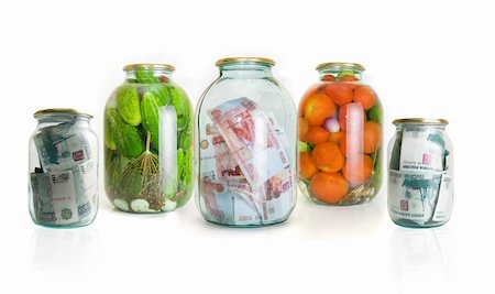 Glass jars with cucumbers tomatoes and money on a white background Stock Photo - Budget Royalty-Free & Subscription, Code: 400-04761382