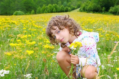simsearch:400-05248187,k - Girl picking flowers in yellow spring meadow beautiful scenic in Pyrenees spain Photographie de stock - Aubaine LD & Abonnement, Code: 400-04761835