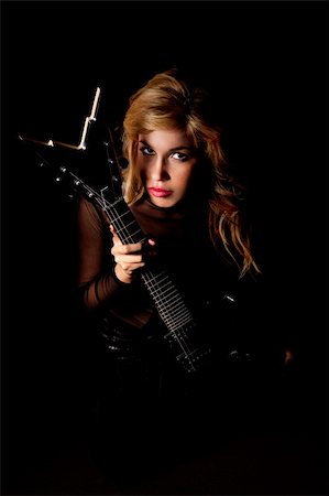 simsearch:400-06750158,k - beautiful young woman sitting with a electric guitar Foto de stock - Royalty-Free Super Valor e Assinatura, Número: 400-04762184