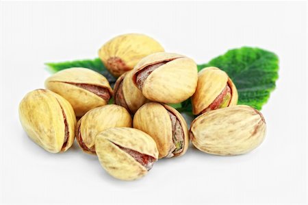 Pistachios on a white background Fotografie stock - Microstock e Abbonamento, Codice: 400-04763199