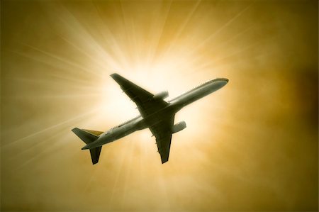 the airplane on  the blue sky background. Stock Photo - Budget Royalty-Free & Subscription, Code: 400-04763395
