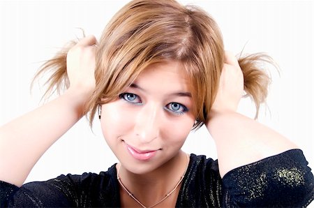 Portrait of a young beautiful blonde making ponytails Stockbilder - Microstock & Abonnement, Bildnummer: 400-04763439