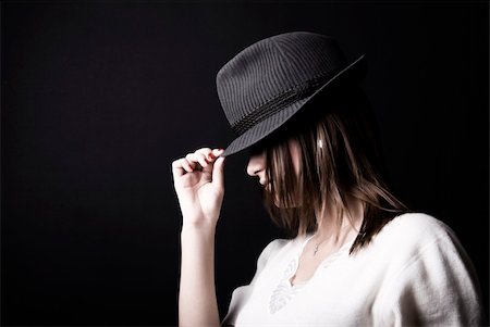 Portrait of a young fashionable brunette in hat Stockbilder - Microstock & Abonnement, Bildnummer: 400-04763451