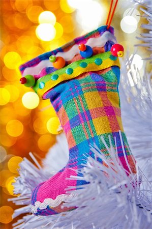 simsearch:400-05177023,k - Decorative boots on a white Christmas tree. Colorful bokeh in the background. Stock Photo - Budget Royalty-Free & Subscription, Code: 400-04763453