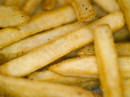 simsearch:400-07993733,k - Closeup of a Serving of Seasoned French Fries Photographie de stock - Aubaine LD & Abonnement, Code: 400-04763959