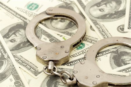 Handcuffs on money background, business security concept Stock Photo - Budget Royalty-Free & Subscription, Code: 400-04774148