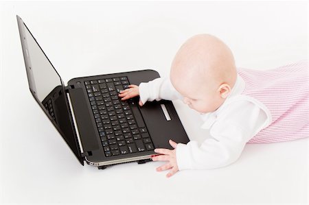 simsearch:400-04129482,k - baby with laptop on a white background in studio Photographie de stock - Aubaine LD & Abonnement, Code: 400-04774578