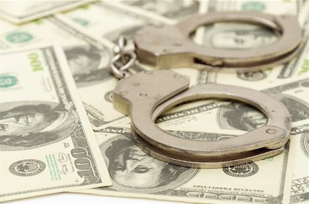 Handcuffs on money background, business security concept Stock Photo - Budget Royalty-Free & Subscription, Code: 400-04775055