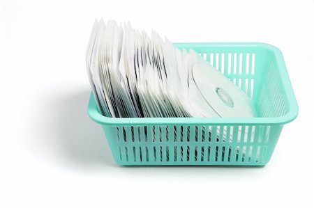 simsearch:400-04777266,k - Compact Discs in Plastic Basket on White Background Photographie de stock - Aubaine LD & Abonnement, Code: 400-04775224